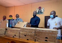 House of Reps’ member, Ifeanyi Momah, presents school items to constituents