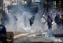 French police, workers clash at May Day rallies