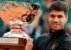 Carlos Alcaraz shows off the trophy after his victory