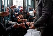 Millions of children suffer from Trump aid cuts Afghan children receive food aid from a local charity in Mazar-i-Sharif on March 2, 2025