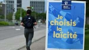 A sign for the federal Bloc Québécois reads in French 'I choose secularism'