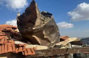 Fragments severely damage a rooftop in east Jerusalem, March 16, 2026. (credit: ISRAEL FIRE AND RESCUE AUTHORITY)