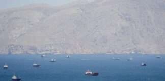 US threatens shipping firms with sanctions if they pay Iran tolls